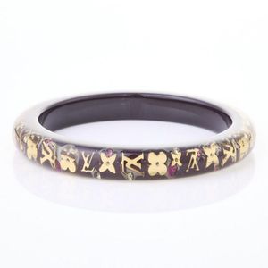 A Louis Vuitton monogram Inclusion bangle.Features gold tone LV ...