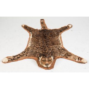 An unusual tiger skin cat skin rug with taxidermy head, 20th…
