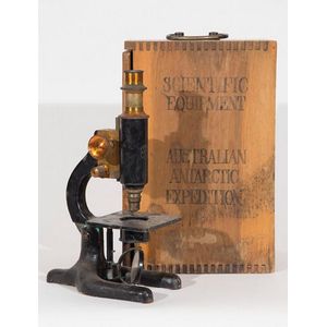 Monocular microscope japanned brass, the carry case stamped…