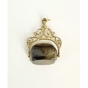 A 9ct gold and smoky quartz spinner fob. Weight 6.7g.