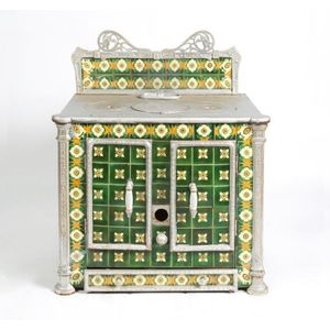 An Art Nouveau stove, cast iron with floral tiles, French,…