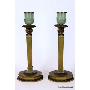 A pair of Empire style gilt bronze candlesticks, circa 1900,…