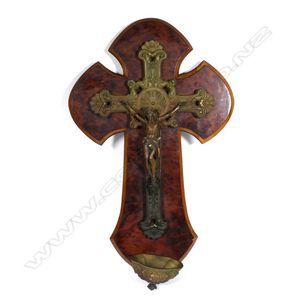 A vintage European bronze crucifix, attached to a wood cross…