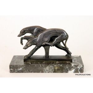 An Art Deco spelter greyhound group, circa 1920, the hurdling…
