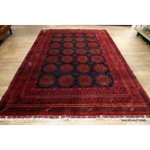 An Afghan Bokhara tribal wool carpet, 20th century woven on a…