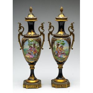 A pair of hand painted French twin handled urns with acorn…