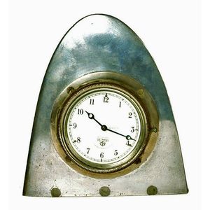 A vintage 'Smith's' 1920s/30s car clock, mounted on aluminium…
