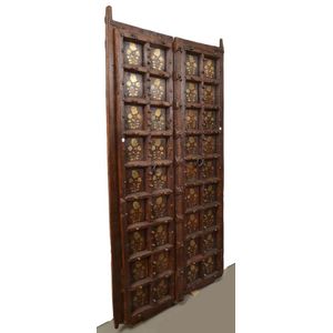 A pair of Indian brass inlaid wood doors, each door articulated…
