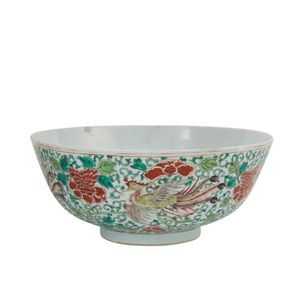 A Chinese porcelain famille rose punchbowl. 19th century, the…