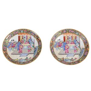 A pair of Chinese porcelain chargers. Each painted in the…