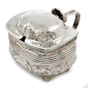 A pair of silver plate wine coasters, a candlestick and a…