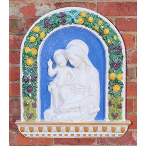 An Italian Majolica wall plaque of Madonna and Child, the…