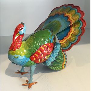 A collection of animal tin toys, mostly wind-up, including a…
