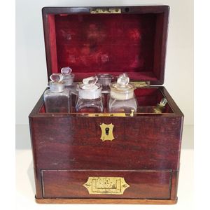 A rosewood velvet-lined homeopathic medicine chest containing…