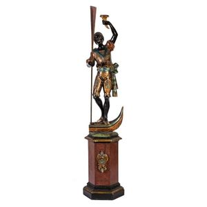 A blackamoor figured torchere on pedestal base, Italian, late…