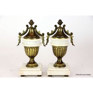 A pair of French marble and bronze urns, the 19th century pair…