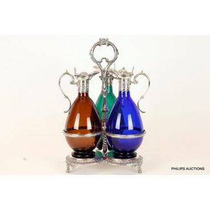 A Victorian silver-plated and coloured glass decanter set and…