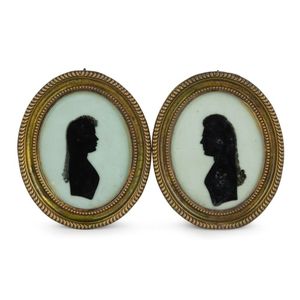 A pair of antique French verre eglomise silhouette miniatures&hellip;