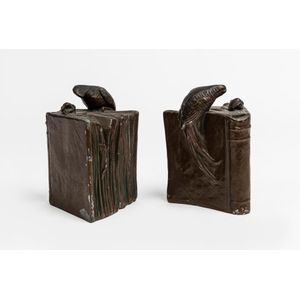 A pair of patinated metal Australian parrot figured bookends,…
