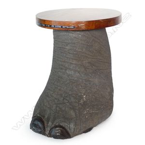 An occasional table fashioned from an elephant foot with fitted…