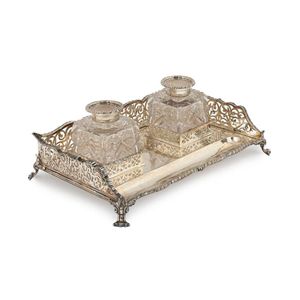 An antique English sterling silver desk set with original…