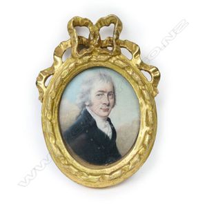 An antique portrait miniature of a gent, on ivory, wearing a…