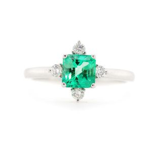 Emerald and diamond set 18ct white gold ring marked 750. Approx…