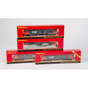 Powerline: an identical group of 4 locomotives; in boxes