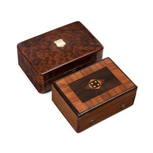 Two cased brass music box mechanisms, one in a walnut and…