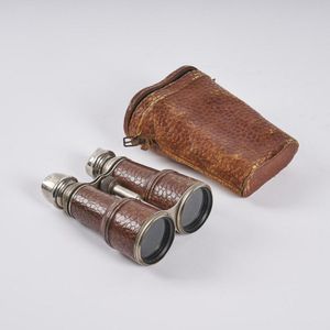A pair of vintage crocodile skin binoculars, includes original…