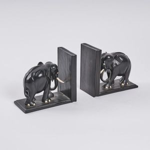 A pair of elephant bookends, all tusks intact, height 17.5 cm,…