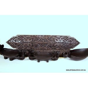 two carved Dayak Shields, two food bowls and a Pourer, the&hellip;