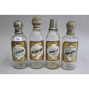 Set of four American drug store bottles, Pineapple, Lemon,…