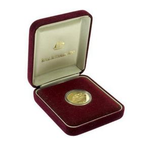 A one hundred dollar Uncirculated gold coin, floral Emblems of…
