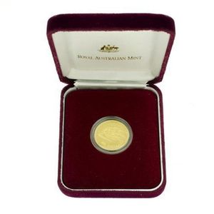 A one hundred dollar Uncirculated gold coin, floral Emblems of…