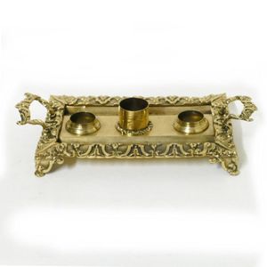 A 19th century brass standish, with cast frame supporting a…