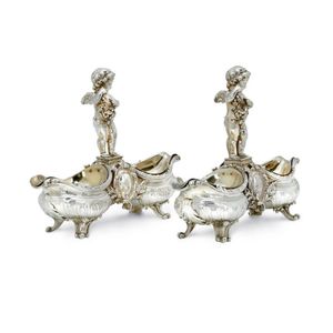 A pair of French silver and silver gilt figural double salt…