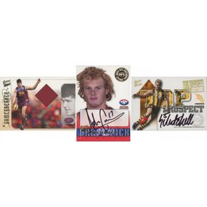 2004 football cards in two albums, including Select chase cards…