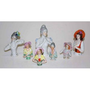 Collection seven various ceramic half dolls height 11 cm tallest
