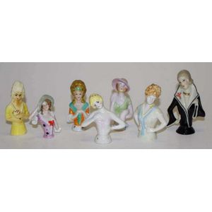Collection seven various ceramic half dolls height 10 cm tallest