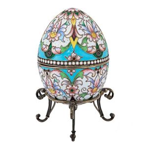 A Russian silver gilt and cloisonne enamel egg on stand,…