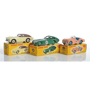 Three Dinky sports cars, including 111 Triumph TR2, salmon pink…
