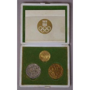 Cased 1964 Tokyo Olympics medallion set, comprising of a…