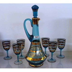 A blue glass liqueur set, setting for six, with gilt stripe…