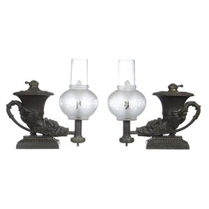 A pair of classical revival darkly patinated bronze oil lamps,…