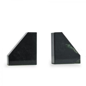 A pair of pounamu bookends, contemporary minimalist design with…