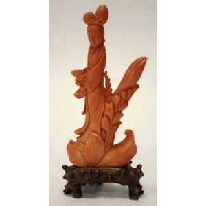 Chinese carved coral Guan Yin figure on carved wood stand,