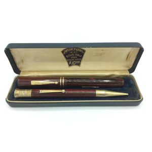 Morton pen and pencil set in red 'wood' design in box, box not…