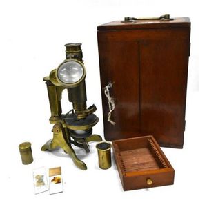 A Victorian mahogany brass microscope, retailed by Clarksons…