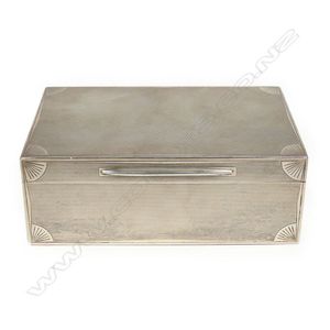 A silver cigarette box, of oblong shape, London 1929 by Ramsden…